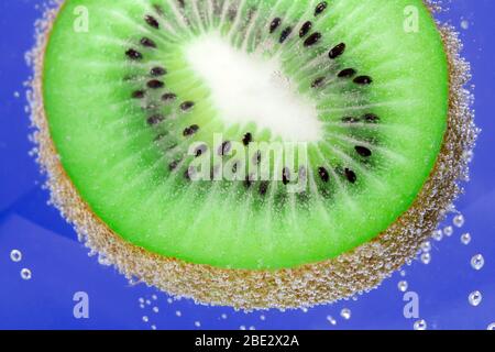 kiwi fruit, background in water, under water. background texture Stock Photo