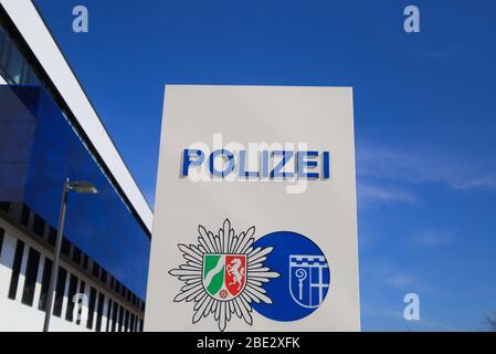 Mönchengladbach, Germany (NRW) - April 10. 2020: Isolated german Polizei logo in front of police station against blue sky Stock Photo