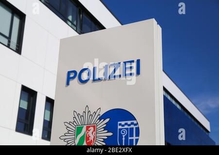 Mönchengladbach, Germany (NRW) - April 10. 2020: Isolated german Polizei logo in front of police station against blue sky Stock Photo