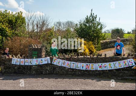 Dreeny, West Cork, Ireland. 11th Apr, 2020. Three brothers created a 'Thank You' sign for the frontline workers battling against the Covid-19 virus. Matthew (8), Jonathan (12) and Stephen (10) O'Neill from Dreeny, near Skibbereen, took a day to design and paint the banner. Their mum, who is a nurse with the HSE working at Bantry Hospital, laminated the sign. Credit: AG News/Alamy Live News Stock Photo