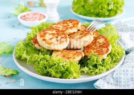 Chicken cutlets with fresh lettuce salad on plate Stock Photo