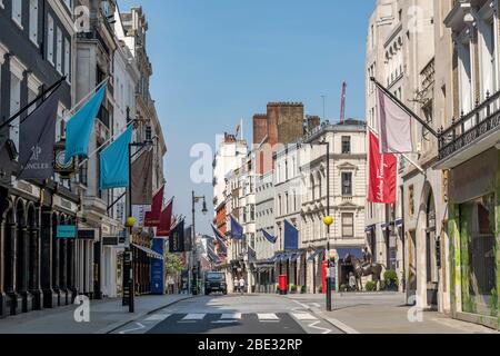 Empty and quiet luxury shopping street in London during the 