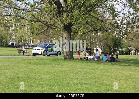 London, UK. 11th Apr, 2020. Police persuading people to keep on the move on Primrose Hill, on a hot and sunny Easter Saturday, in the middle of the coronavirus pandemic lockdown. Credit: Monica Wells/Alamy Live News