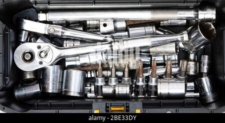 small tool box full of mechanics chrome plated sockets and ratchets Stock Photo