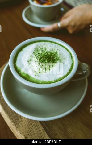 Drink with powdered cup of matcha green tea Stock Photo