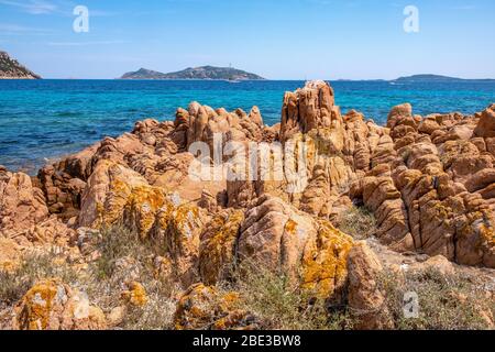 Panoramic view of Spalmatore di Terra peninsula of Marine Protected Area reserve with seashore rocks of Isola Tavolara island on Tyrrhenian Sea Stock Photo