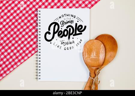 Wooden tied ladles with blank notebook page on a table Stock Photo