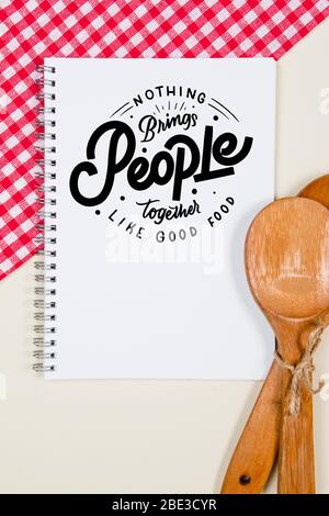 Wooden tied ladles with blank notebook page on a table Stock Photo