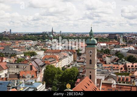 A view of the city of Munich, Germany, from the tower of St Peter's Church in the old town, with the Heiliggeistkirche (Holy Ghost church) in front. Stock Photo