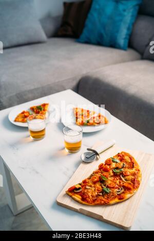 Domestic food and homemade pizza. Enjoying dinner with friends. Romantic Couple Italian dinner Stock Photo