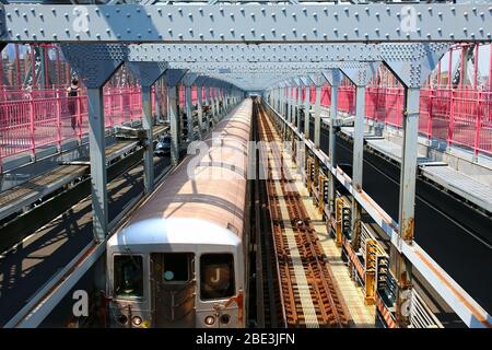 Brooklyn-bound R42 J train rides across Williamsburg Bridge, Manhattan on July 27th, 2019 in New York, USA. (Photo by Wojciech Migda) Stock Photo