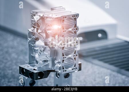 Industrial  concept. Repair motor block of cylinders, operator inspection dimension aluminium automotive par in industrial factory Stock Photo