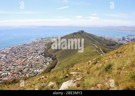Beautiful South African Coastline near Cape Town with Signal Hill and Atlantic Ocean. Photo taken from Lion's Head near Cape Town in South Africa. Stock Photo