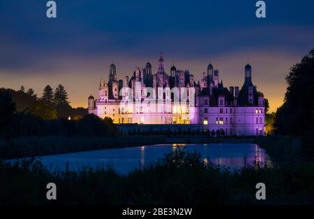 France, Loir-et-Cher (41), Chambord (Unesco World Heritage), royal castle from Renaissance period illuminated by night, viewed from the canal Le Cosso