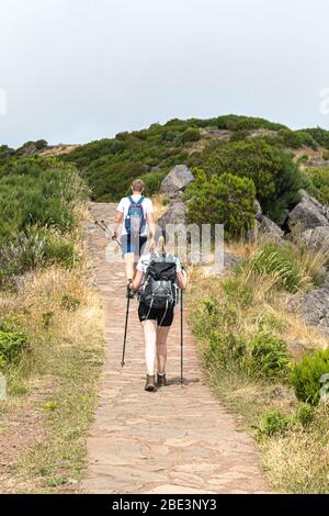 FUNCHAL, PORTUGAL - JULY 27, 2018: Tourists are hiking in the mountains of Madeira, Portugal. Stock Photo