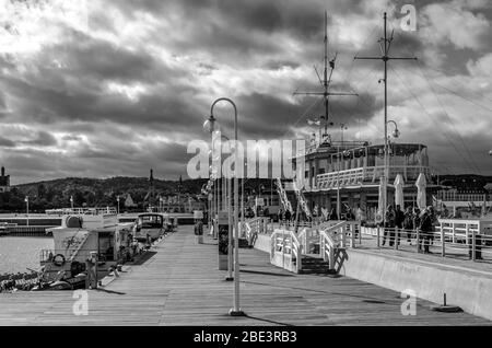 SOPOT PIER ,POLAND : 26 SEPTEMBER 2018 ; Tourists and city residents walking along the Sopot Pier during a warm autumn afternoon. Stock Photo