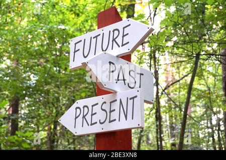 Signpost with three arrows Stock Photo