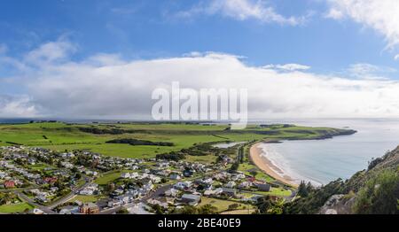 Panoramic view atop the Nut over the town of Stanley in Tasmania and its quaint village houses fringing one of the bays, from the scenic lookout. Stock Photo