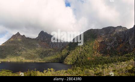 Panoramic vista of a mountain lake and the alpine flora in the Cradle Mountain National Park's Overland Track. Stock Photo