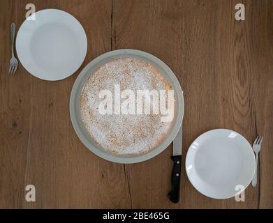 Appetit: A delicious Cheesecake prepared at two plates, ready to cut Stock Photo