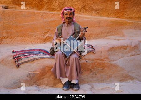 Old Man Playing Traditional Bedouin Musical Instrument (Rababah Stock ...