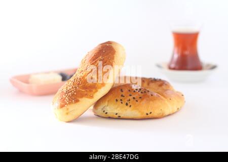 Turkish Pastry Pogaca and tea on white background. Traditional Bakery Stock Photo