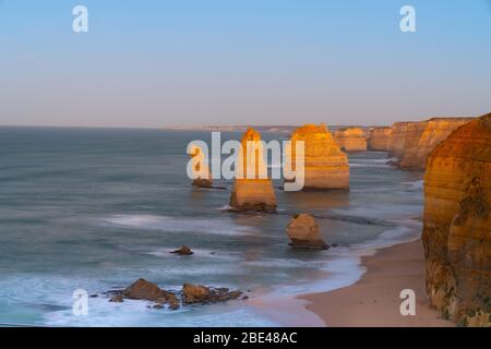 The Twelve Apostles at sunrise  limestone stacks that attract tourists from around world on Great Ocean Road in Victoria Australia Stock Photo