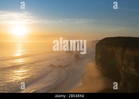 Twelve Apostles collection of limestone stacks at sunset along Great Ocean Road in Port Campbell National Park of Victoria Australia. Stock Photo