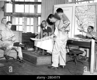 Tokyo war crimes trial. 'Lieut. Gen. Shizuo Yokoyama points to a map to give disposition of his 8th Division troops as he testifies in the trial in Manila of Lieut. Gen. Tomoyuki Yamashita, Japanese officer charged with being a war criminal. Next to Yokoyama is Capt. Jack Pace, ... member of the prosecution staff. Capt. Adolf Reel (arm akimbo), defense counsel, looks over Pace's shoulder.  (Others unidentified) 11-23-45' [photo text]  Gen. Yamashita was found guilty. After various legal appeals, he was hung on Feb. 23, 1946.  To see my other WW II-related photos, Search: Prestor vintage WW II Stock Photo