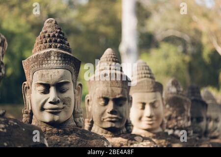 Head sculptures at South gate to Bayon temple, Angkor Wat complex; Siem  Reap, Cambodia Stock Photo