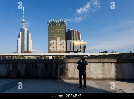 A man photograhps the view of Tokyo Skytree from the Asakusa riverside. Tokyo, Japan. Stock Photo