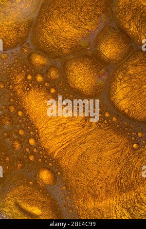 abstract background with bubbles oil. Yellow Soap Bubbles Stock Photo