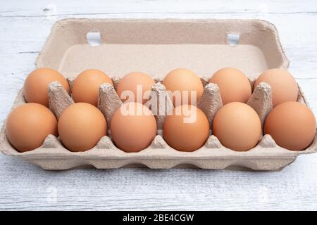 Dozen eggs in cardboard package closeup Stock Photo