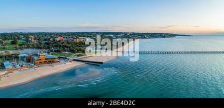 Frankston Yacht Club, footbridge and the pier at sunset in Melbourne, Australia - wide aerial panoramic landscape Stock Photo