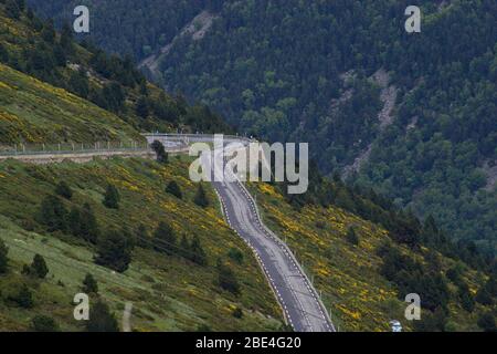 Hairpin bend on the road out of Andorra into France in the Pyrenees mountain range Stock Photo