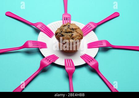 Blueberry Muffin with Paper Plate on Blue Background Stock Photo