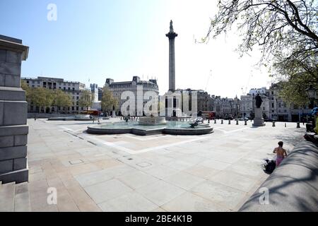 London, UK. 11th Apr, 2020. Day Nineteen of Lockdown in London.  A deserted Trafalgar square in London on Easter Saturday. It is the first public holiday of the year, and many people enjoy the long weekend by going out and about or on holiday, but this year the country is on lockdown due to the COVID-19 Coronavirus pandemic. People are not allowed to leave home except for minimal food shopping, medical treatment, exercise - once a day, and essential work.  COVID-19 Coronavirus lockdown, London, UK, on April 11, 2020 Credit: Paul Marriott/Alamy Live News