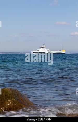 The 100 percent electric propelled domestic car and passenger ferry ELLEN passes Skjoldnæs on the northernmost tip of the Danish island Ærø. Stock Photo