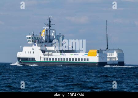 The 100 percent electric propelled domestic car and passenger ferry ELLEN passes Skjoldnæs on the northernmost tip of the Danish island Ærø. Stock Photo