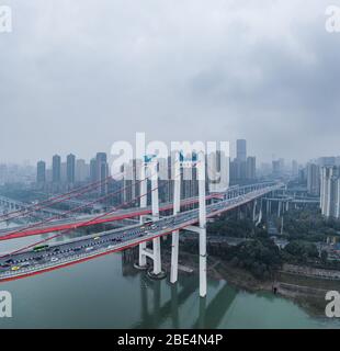 Dec 22, 2019 - Chongqing, China: Aerial drone shot of E'gongyan bridge by Jialing river Stock Photo