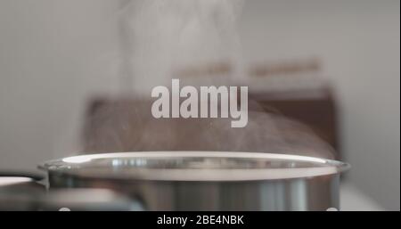 steam rising from pot while cooking Stock Photo