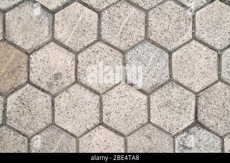 hexagonal paving slabs gray correct configuration background. structure close-up Stock Photo