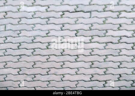 polygonal paving slabs gray correct configuration background. structure close-up Stock Photo