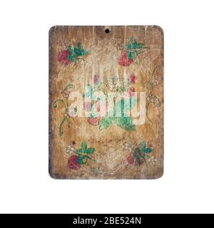 Old wooden kitchen cutting board decorated with children pattern Stock Photo
