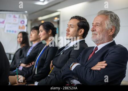 Business people sit and listen to the seminar in the meeting room Stock Photo