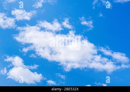 Fluffy white clouds on a sunny day. Stock Photo