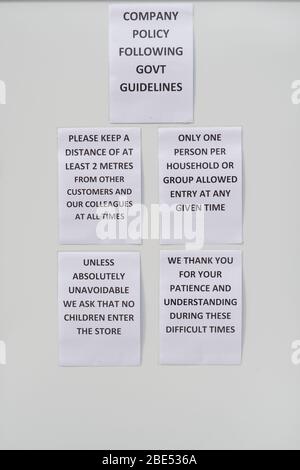 Cumbernauld, UK. 12th Apr, 2019. Pictured: Shop sign advising customers on social distancing. Scenes during the Coronavirus (COVID-19) lockdown from a retail park in Cumbernauld. Shoppers queue outside to get their bargains and supplies for the Easter Sunday festive period. Credit: Colin Fisher/Alamy Live News Stock Photo