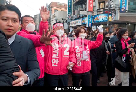 Seoul, South Korea. 11th Apr, 2020. Hwang Kyo-Ahn and Choi Ji-Young, Apr 11, 2020 : Wearing masks to prevent COVID-19 coronavirus infection, Hwang Kyo-Ahn (3rd L), chairman of South Korea's main opposition United Future Party (UFP) and his wife Choi Ji-Young (4th L) attend his election campaign for the April 15 parliamentary elections in his electoral district of Jongno Ward in Seoul, South Korea. Hwang's headband reads, 'Economic Renewal'. Hwang is running for the election in Jongno, a symbolic constituency in Korean politics where influences in politics are elected. Lee Nak-Yon, former prime Stock Photo