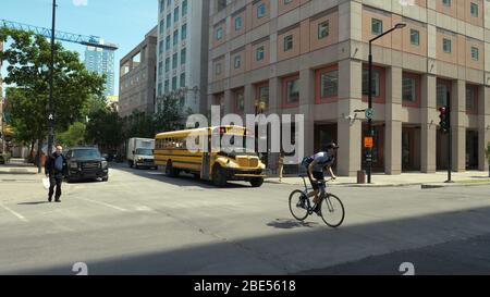 Montreal, Quebec, Canada - 25 June, 2018: School bus stopped at traffic light. Stock Photo