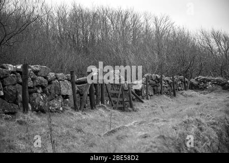 Gate in granite wall. Stock Photo